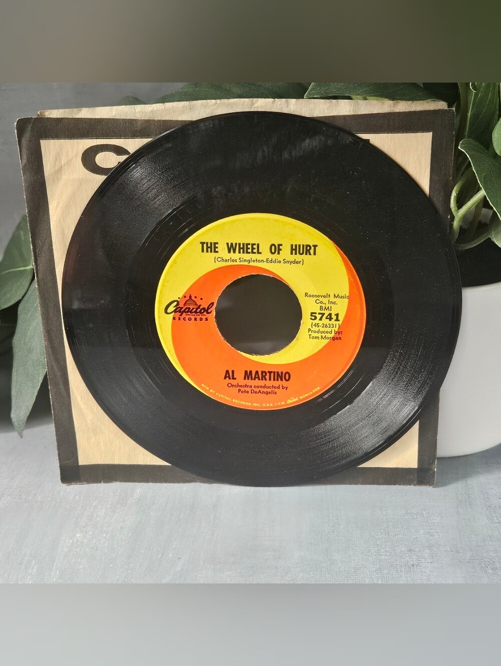 Al Martino 7-inch 45 RPM vinyl single of "The Wheel of Hurt" released on Capitol